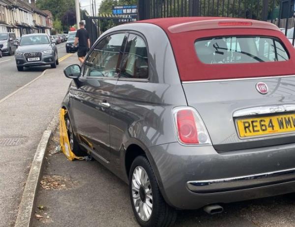 Fiat 500 for sale at Strood Motor Centre, Kent, was found clamped by the DVLA on August 31 2023. Photo released September 10 2023. See SWNS story SWLSclamped.Staff at a car dealership were left raging after one of their vehicles was clamped by the DVLA - the same day it was due to be sold. The clamp was found on a Fiat 500 parked in front of Strood Motor Centre in Strood, Kent last mo<em></em>nth (31/08). Max Mannouch, 21, said staff came in to find the clamped car and originally thought it was a practical joke.